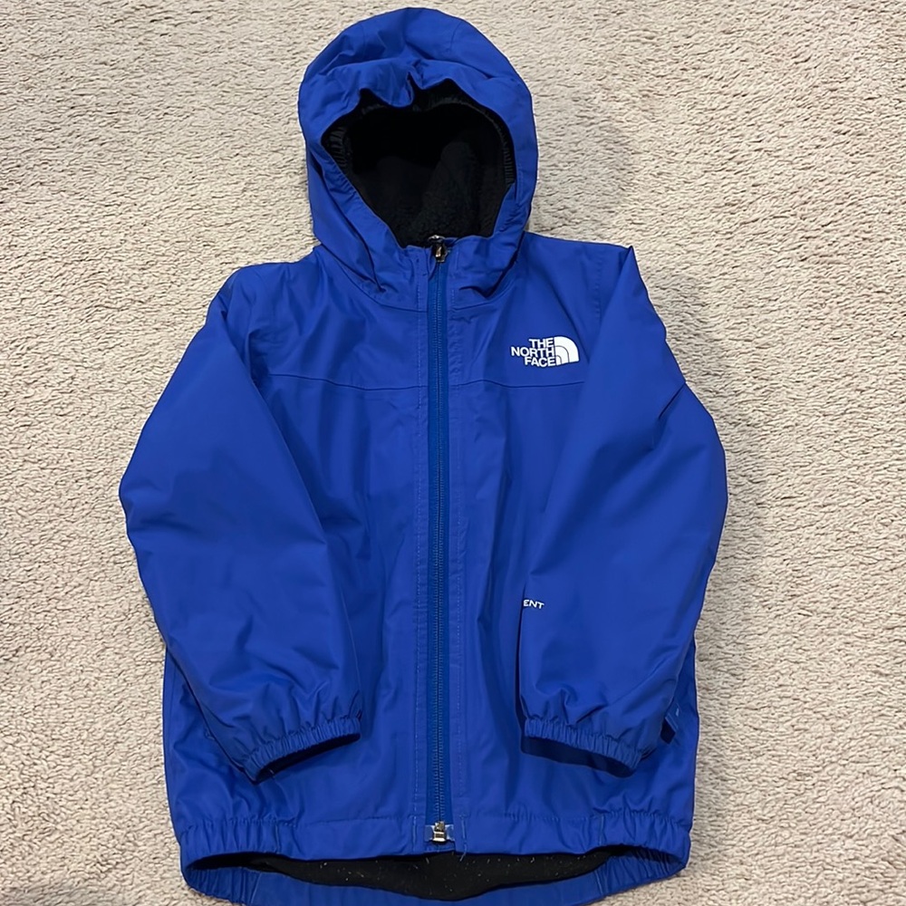 The North Face 3T coat. Water resistant with fleece interior. Gently used.